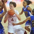 Arkansas forward Sarah Watkins drives to the hoop between Coppin State defenders (left to right) LAr...