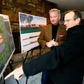 Mike Luttrell of Springdale and property owner Tom Lundstrum, left, look over the proposed site Dec....