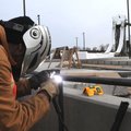 Everett Hice welds railings Thursday near one of the water slides at the Rogers aquatic center. 