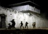 Soldiers approach the compound of Osama bin Laden in Zero Dark Thirty. 