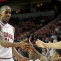 Arkansas guard BJ Young gets high fives from his teammates as he leaves the game late in the second ...