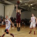 Springdale’s Brittany Jurgens, center, puts an open shot up between Webb City (Mo.) defenders Mikael...