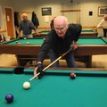 Sherman Stratton lines up a shot Friday during a game of eight-ball at the Benton County Senior Acti...