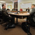 Councilman Justin Tennant, right, speaks to newly elected council members during orientation. 