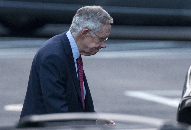 senate-majority-leader-harry-reid-of-nev-leaves-the-white-house-in-washington-friday-dec-28-2012-after-a-closed-door-meeting-between-president-barack-obama-and-congressional-leaders-to-negotiate-the-framework-for-a-deal-on-the-fiscal-cliff-the-end-game-at-hand-president-barack-obama-and-congressional-leaders-made-a-final-stab-at-compromise-friday-to-prevent-a-toxic-blend-of-middle-class-tax-increases-and-spending-cuts-from-taking-effect-at-the-turn-of-the-new-year