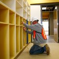 Tim Devall with Architectual Concepts works Friday on the cubbies inside one of the classrooms on at...