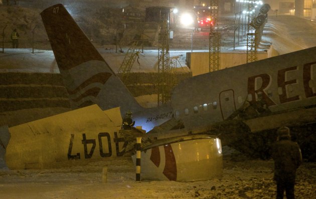 wreckage-of-a-plane-which-careered-off-the-runway-at-vnukovo-airport-in-moscow-saturday-dec-29-2012-a-tu-204-aircraft-belonging-to-russian-airline-red-wings-careered-off-the-runway-at-russias-third-busiest-airport-on-saturday-broke-into-pieces-and-caught-fire-killing-several-people