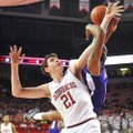 Arkansas forward Hunter Mickelson (21) and Northwestern State forward DeQuan Hicks (right) battle fo...