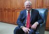 Jim Rollins, Springdale Public Schools superintendent, smiles Dec. 21 in his office at 804 W. Johnson Ave. in Springdale. Rollins became superintendent of Springdale Public Schools in 1982. He began his career as a junior high school science teacher in North Little Rock in 1972.