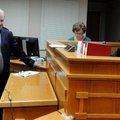 Jeff Harper, left, speaks with Ernest Cate, Springdale District Judge, Friday during Harper’s last d...
