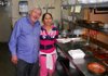 Ken Shivey, owner of The Villa, with employee Lourdes Melo, share a hug in the now-closed restaurant’s kitchen. 