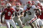 Georgia running back Todd Gurley (3) runs for a 24-yard touchdown past the Nebraska defense during the first half of the Capital One Bowl NCAA football game, Tuesday, Jan. 1, 2013, in Orlando, Fla. (AP Photo/John Raoux)