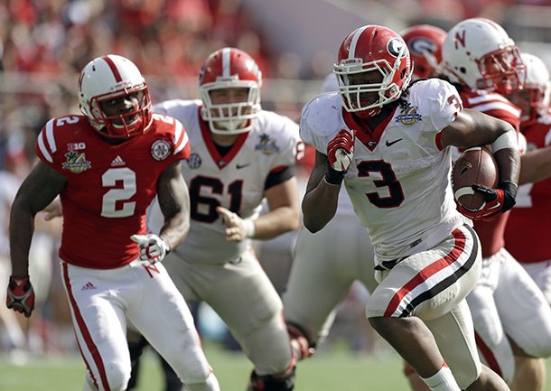 georgia-running-back-todd-gurley-3-runs-for-a-24-yard-touchdown-past-the-nebraska-defense-during-the-first-half-of-the-capital-one-bowl-ncaa-football-game-tuesday-jan-1-2013-in-orlando-fla-ap-photojohn-raoux