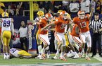 In this photo taken Dec. 31, 2012, Clemson's Chandler Catanzaro (39) and Spencer Benton (13) celebrate after Catanzaro kicked a 37-yard field goal as time expires to beat LSU 25-24 in the Chick-fil-A Bowl NCAA college football game at the Georgia Dome in Atlanta, Ga. (AP Photo/Anderson Independent-Mail, Mark Crammer) 