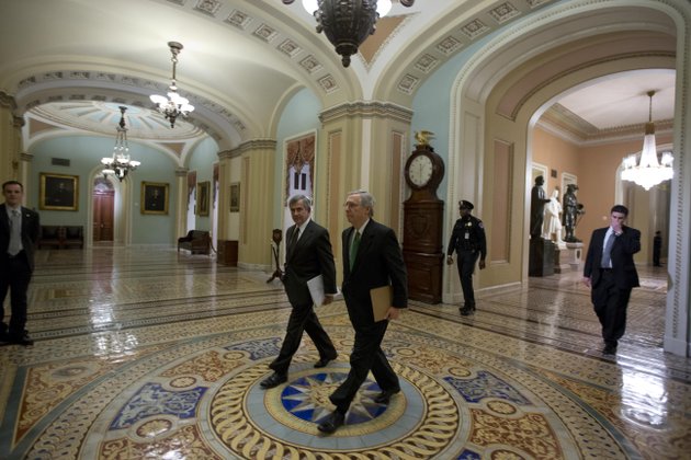 sen-mike-johanns-r-neb-left-walks-with-senate-minority-leader-mitch-mcconnell-from-kentucky-to-the-senate-floor-for-a-vote-on-the-fiscal-cliff-on-capitol-hill-tuesday-jan-1-2013-in-washington-the-senate-passed-legislation-early-new-years-day-to-neutralize-a-fiscal-cliff-combination-of-across-the-board-tax-increases-and-spending-cuts-that-kicked-in-at-midnight