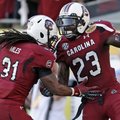South Carolina wide receiver Bruce Ellington (23) celebrates with teammate Kenny Miles (31) after sc...
