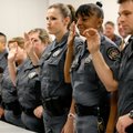 Deputies are sworn in by Circuit Judge Doug Schrantz. 