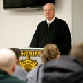 Circuit Judge Doug Schrantz swears in deputies Tuesday in Bentonville. 