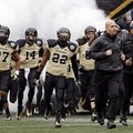Vanderbilt head coach James Franklin, second from right, leads his team onto the field for the Music...