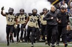 Vanderbilt head coach James Franklin, second from right, leads his team onto the field for the Music City Bowl NCAA college football game against North Carolina State, Monday, Dec. 31, 2012, in Nashville, Tenn. (AP Photo/Mark Humphrey)