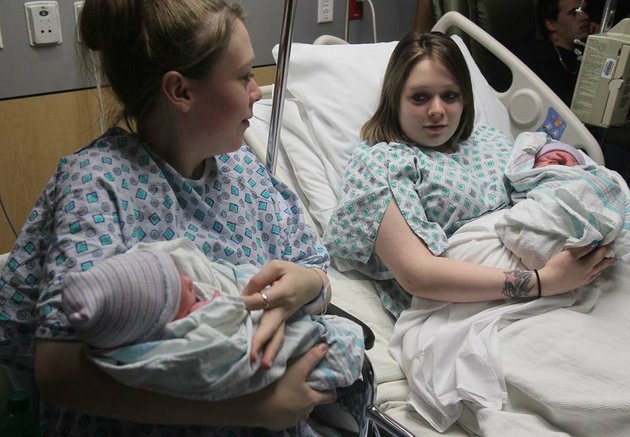 twin-mothers-aimee-left-and-ashlee-nelson-hold-their-newborn-sons-donavyn-bratten-left-and-aiden-lee-alan-dilts-at-summa-akron-city-hospital-on-monday-dec-31-2012-in-akron-ohio-the-mothers-19-gave-birth-about-two-hours-apart