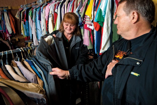 debbie-rutter-left-and-david-forrester-who-were-named-inspiring-people-of-cleburne-county-look-over-some-clothes-at-ssr-helping-hands-in-heber-springs-the-pair-works-with-a-group-that-provides-clothes-for-needy-people-in-cleburne-county-and-were-recognized-by-the-heber-springs-chamber-of-commerce