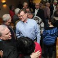 Friends and co-workers congratulate Jeff Harper on becoming the new district judge Tuesday in the Sp...