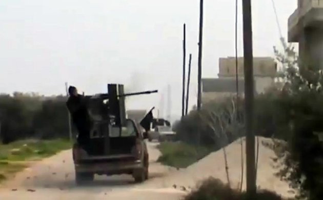 a-free-syrian-army-fighter-fighter-a-weapon-in-taftanaz-village-idlib-province-northern-syria-on-wednesday-jan-2-2013-in-this-image-taken-from-video-obtained-from-the-shaam-news-network-which-has-been-authenticated-based-on-its-contents-and-other-ap-reporting
