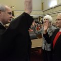 Benton County Circuit Judge Doug Schrantz, left, swears in Benton County District 9 Justice of the P...