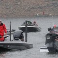 Bundled-up anglers at the Polar Bear bass tournament on New Year’s Day wait to take their boats out ...
