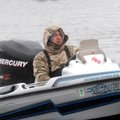Jeff Cook is dressed for the weather while putting his boat on the trailer New Year’s Day at the Pol...