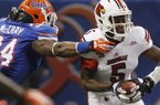 Louisville quarterback Teddy Bridgewater (5) is sacked by Florida linebacker Lerentee McCray (34) in the first half of the Sugar Bowl NCAA college football game Wednesday, Jan. 2, 2013, in New Orleans. (AP Photo/Butch Dill)