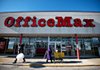 Shoppers exit an OfficeMax store in Peoria, Ill., on Wednesday. Despite early signs of slow Christmas shopping, retailers tracked by Thomson Reuters reported sales that beat analyst expectations. 