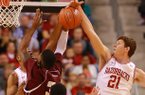 Arkansas sophomore Hunter Mickelson (21) blocks a shot during Arkansas' win over Alabama A&M at Verizon Arena in North Little Rock on Dec. 22, 2012. 