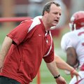 Tim Horton works with Arkansas' running backs during an April 2012 practice at Donald W. Reynolds Ra...