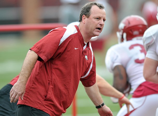 tim-horton-works-with-arkansas-running-backs-during-an-april-2012-practice-at-donald-w-reynolds-razorback-stadium