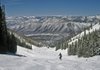 A skier enjoys the view of Roaring Fork Valley in the Aspen Ski Area. 