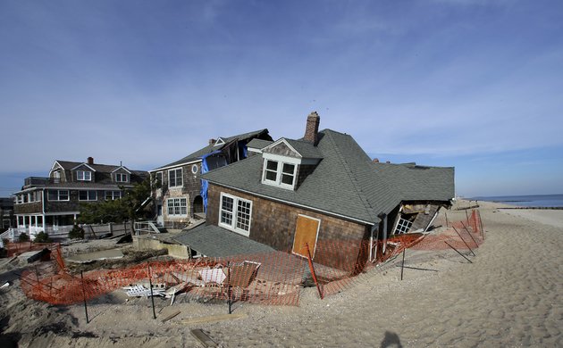 a-beach-front-home-that-was-severely-damaged-two-months-ago-by-superstorm-sandy-rests-in-the-sand-in-bay-head-nj-on-thursday-jan-3-2013
