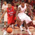 Arkansas guard Mardracus Wade knocks the ball away from Delaware State guard Chris Lewis (34) Saturd...