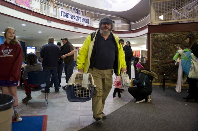 charles-bingham-heads-back-home-with-his-cats-after-a-tsunami-warning-was-canceled-early-saturday-jan-5-2013-in-sitka-alaska-following-a-magnitude-75-earthquake