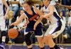 Sydney Crockett of Fayetteville tries to knock the ball away from Rogers Heritage guard Brittany Ward during Friday’s game at Bulldog Arena in Fayetteville. 