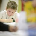 Joey Bellar, 9, colors a drawing of his dream home Friday in the art room at the Boys & Girls Club o...