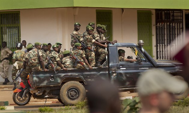 government-security-forces-in-a-pickup-truck-drive-past-a-demonstration-held-by-several-hundred-merchants-calling-for-peace-as-negotiators-prepare-for-talks-with-rebels-from-the-north-in-downtown-bangui-central-african-republic-saturday-jan-5-2013-the-un-security-council-urged-rebels-in-the-central-african-republic-on-friday-to-halt-their-military-offensive-withdraw-from-cities-they-have-seized-and-take-part-in-negotiations-to-find-a-political-solution-to-the-impoverished-countrys-longstanding-problems