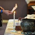 A member of Unity of Fayetteville takes part in the annual burning bowl ceremony Sunday morning at t...