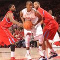 NWA Media/ANDY SHUPE -- Arkansas sophomore guard BJ Young, center, drives through the lane as Delawa...
