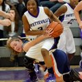 Jaylah Prude, Fayetteville guard, fights for control of the ball Friday against Rogers Heritage guar...