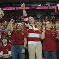 Sami Belford, University of Arkansas band member, in stripes (above), joins Starling Ledbetter, left...