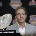 Alabama head coach Nick Saban poses with The Coaches' Trophy during a BCS National Championship coll...