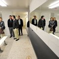 Board members take a look around one of the renovated locker rooms in the Fahring Center at Fayettev...
