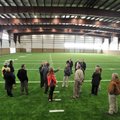 Fayetteville School District board members take a look around the new indoor practice facility at Fa...